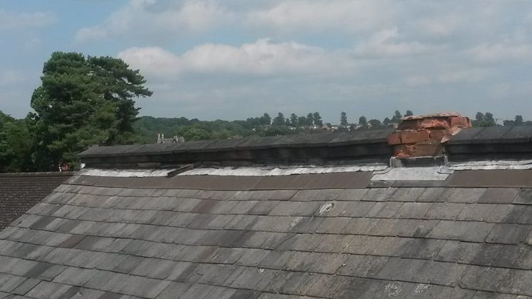 A roof ridge in poor condition of a property in the city centre of Worcester