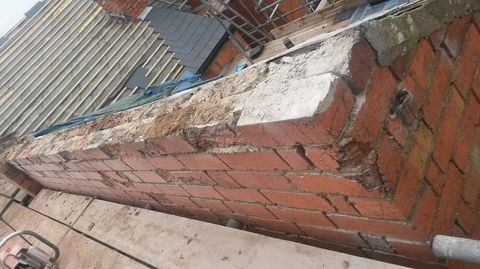 The state of an outside wall after many years of seasonal weathering